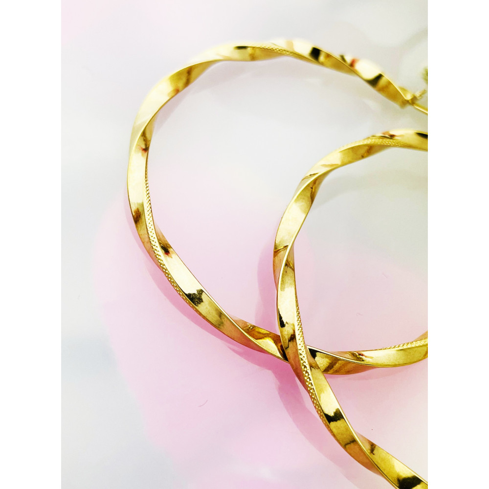 Złote kolczyki koła kręcone spiralne