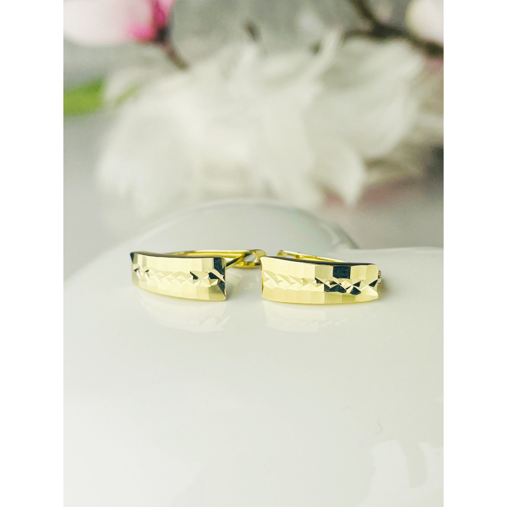 Złote kolczyki półkola zdobione frezowane