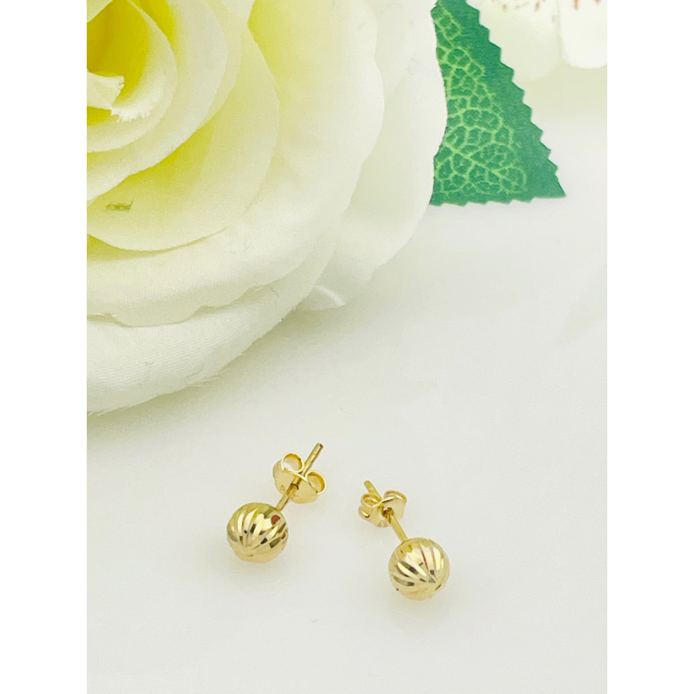 Złote kolczyki kulki frezowane