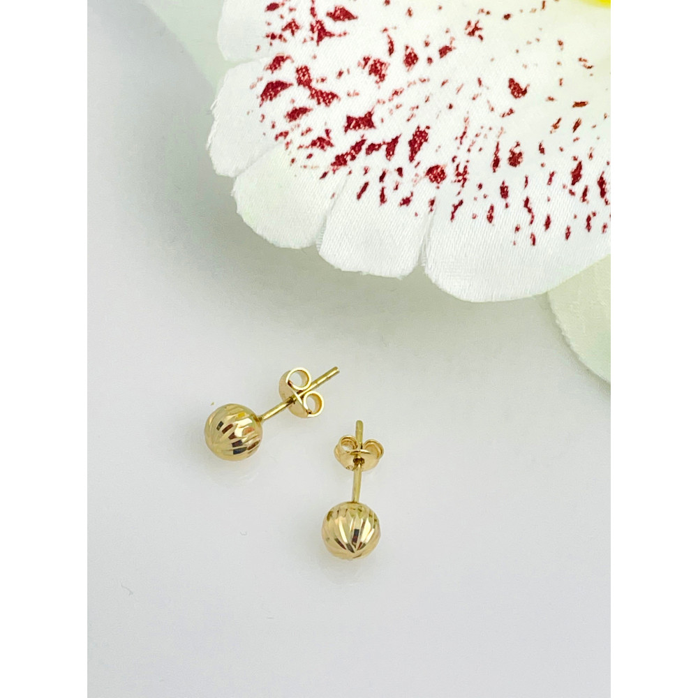 Złote kolczyki kulki frezowane