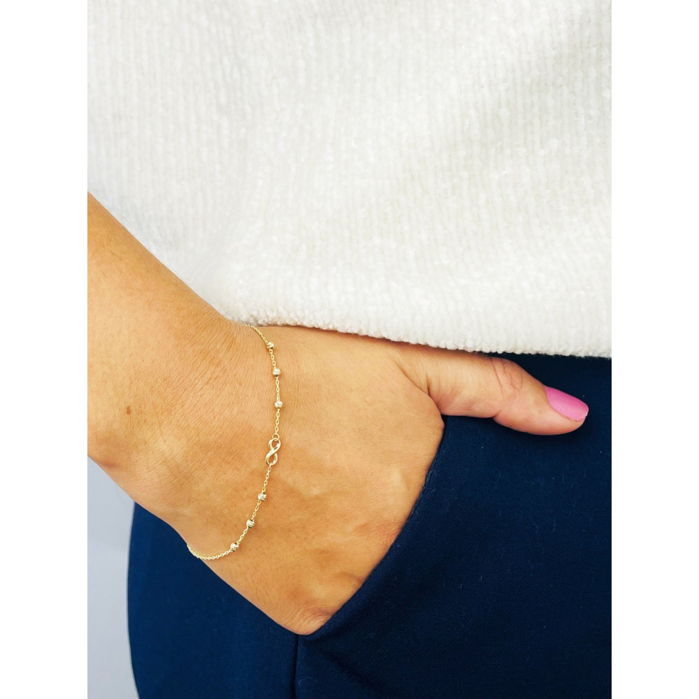 Złota bransoletka ankier nieskończoność kuleczki