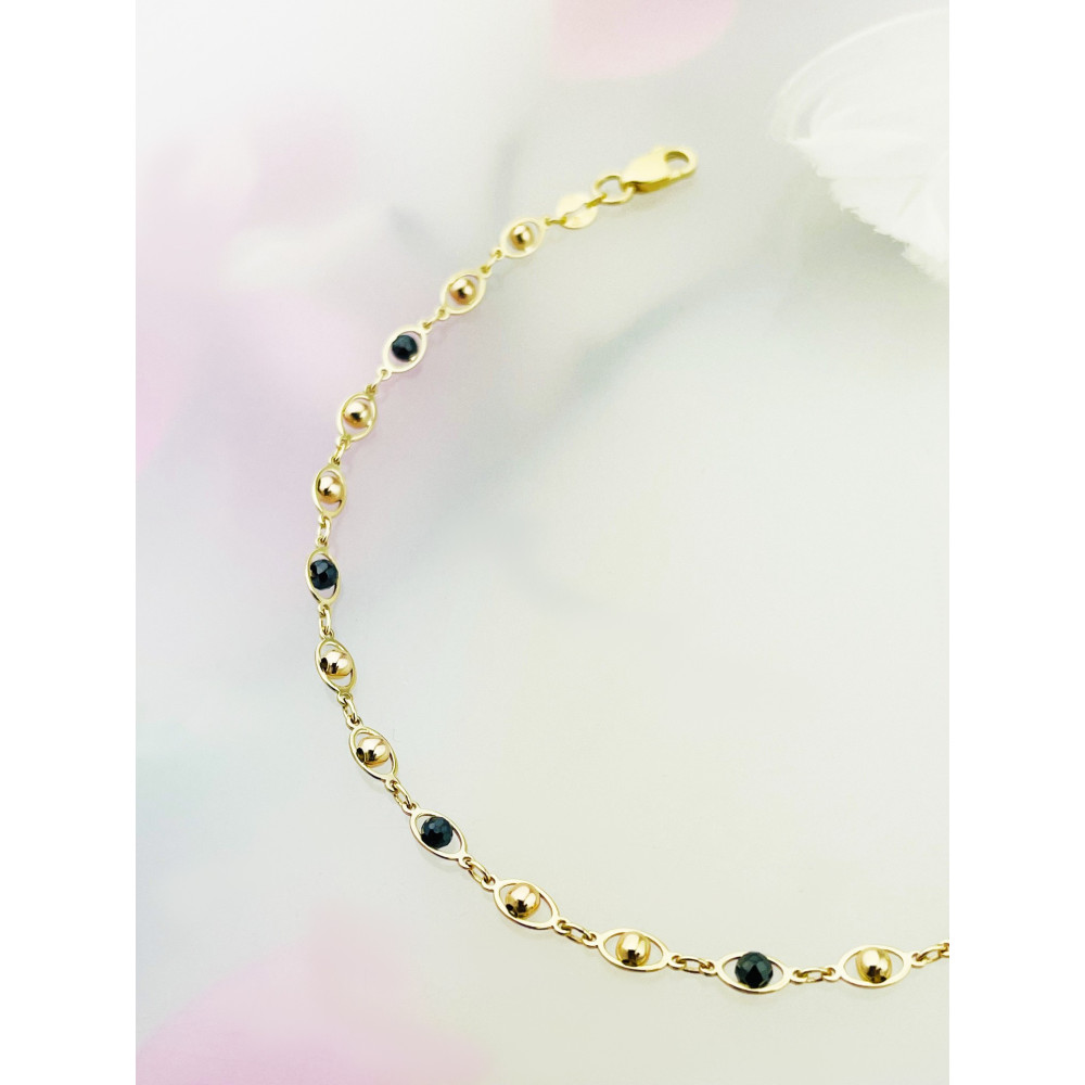 Złota bransoletka kuleczki z onyksem