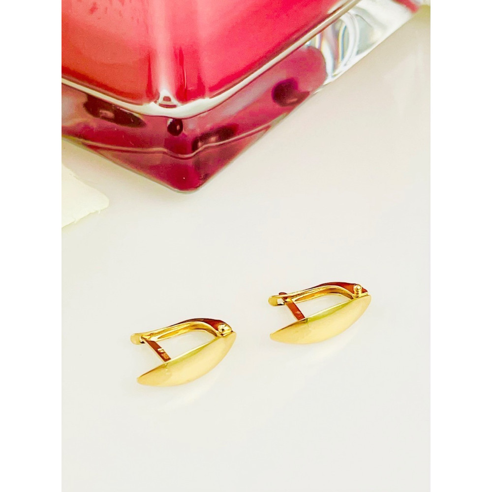 Złote kolczyki przecinki