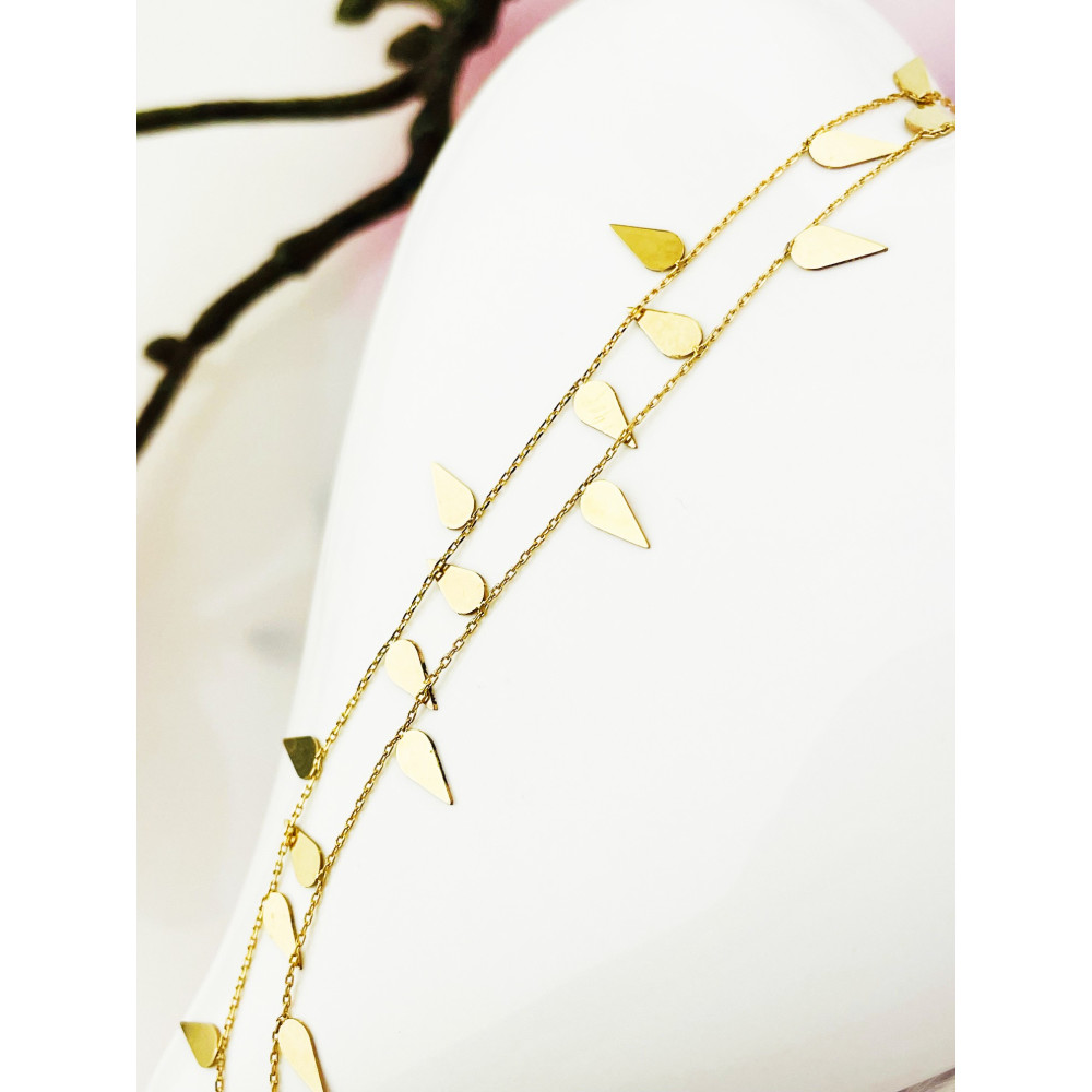 Złota bransoletka na nogę listki