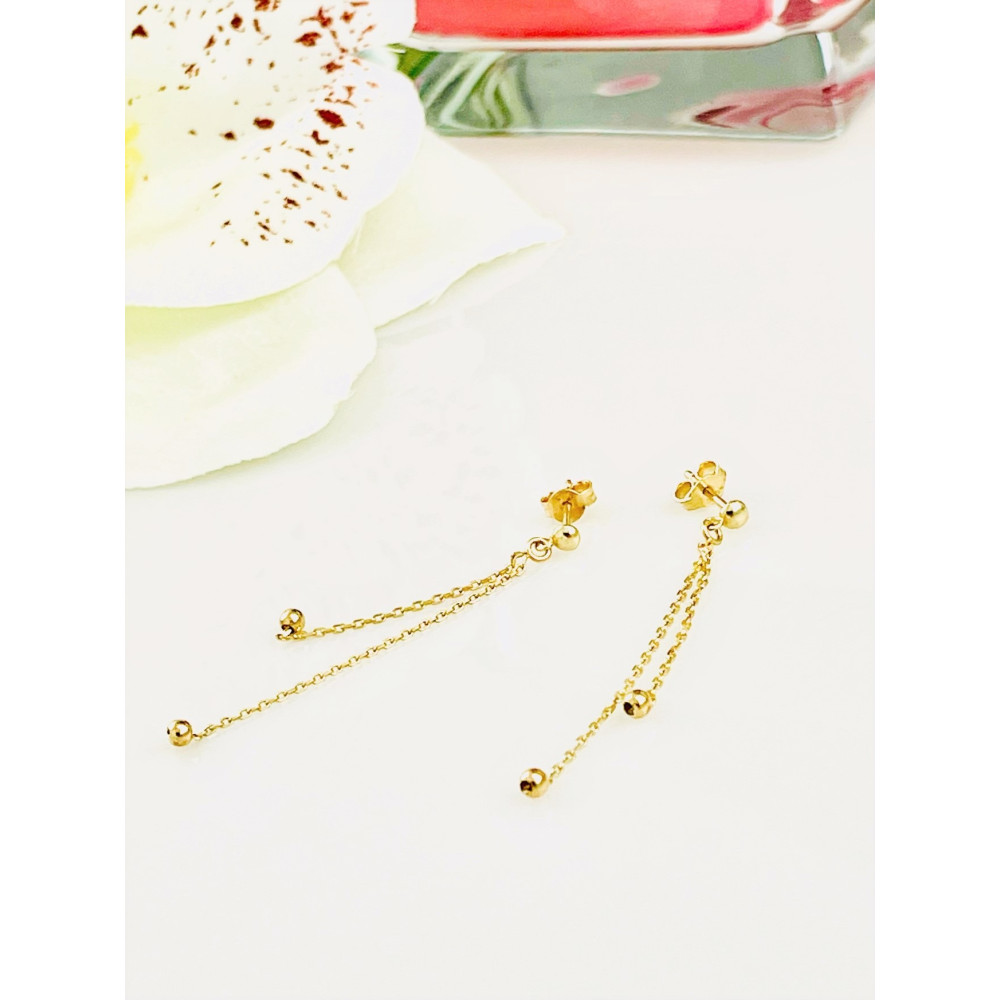 Złote kolczyki wiszące kuleczki