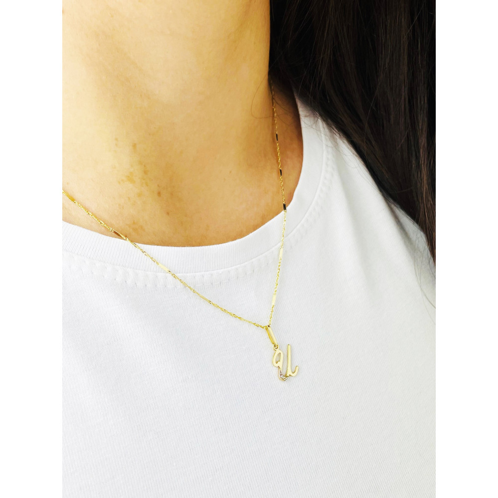 Złoty wisiorek zawieszka ozdobna literka U z cyrkoniami