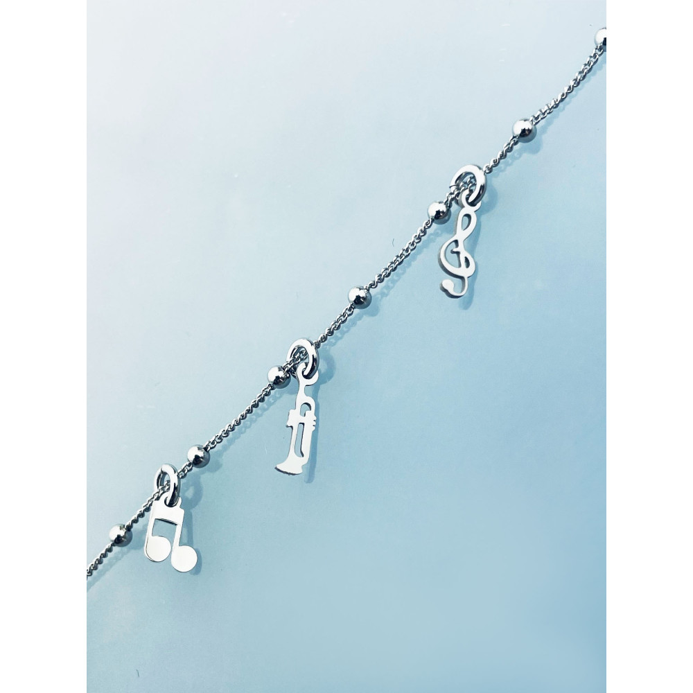 Srebrna bransoletka z motywem muzycznym nutki klucz wiolinowy gitara trąbka saksofon