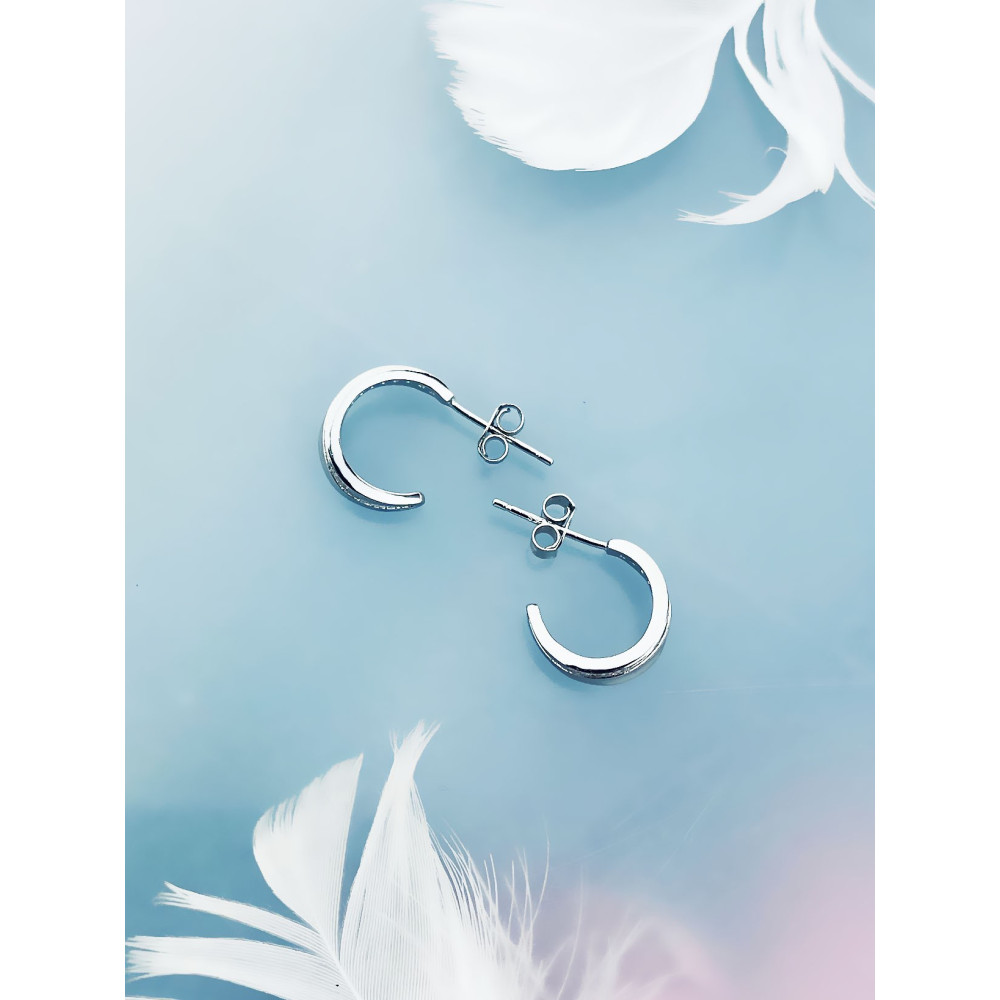 Srebrne kolczyki półkola z cyrkoniami